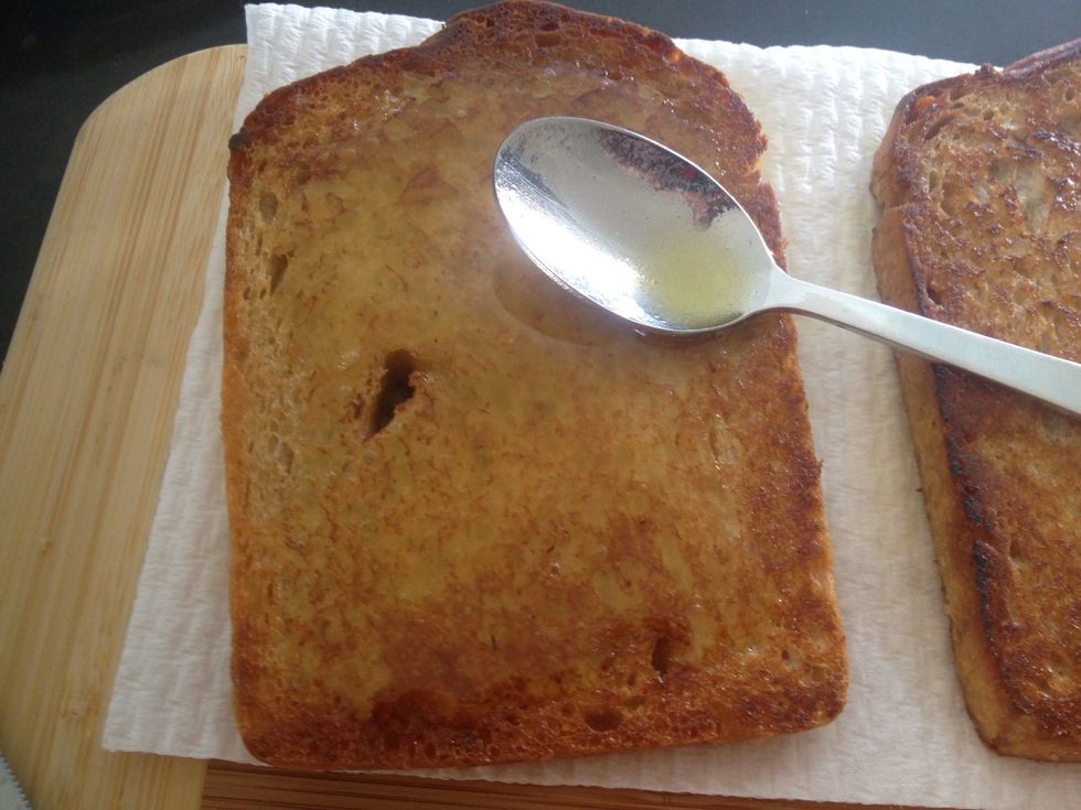 Generously spread vinaigrette on one slice of bread.