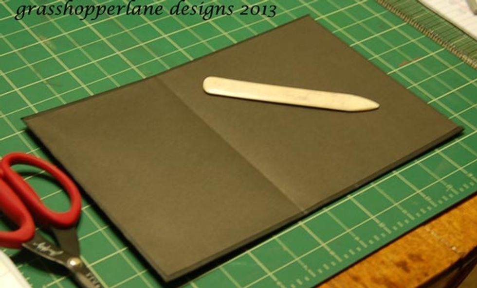 Gentle score the inside folds of book and start to fold them inward with your bone folder.
