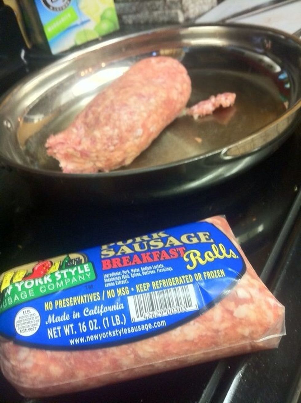 Gently brown one (or two) lbs of bulk sausage.  No need to overcook (some pink is good cause this is going to finish in the oven.)  A hot pan (controlled) will make for some nicely browned sausage.