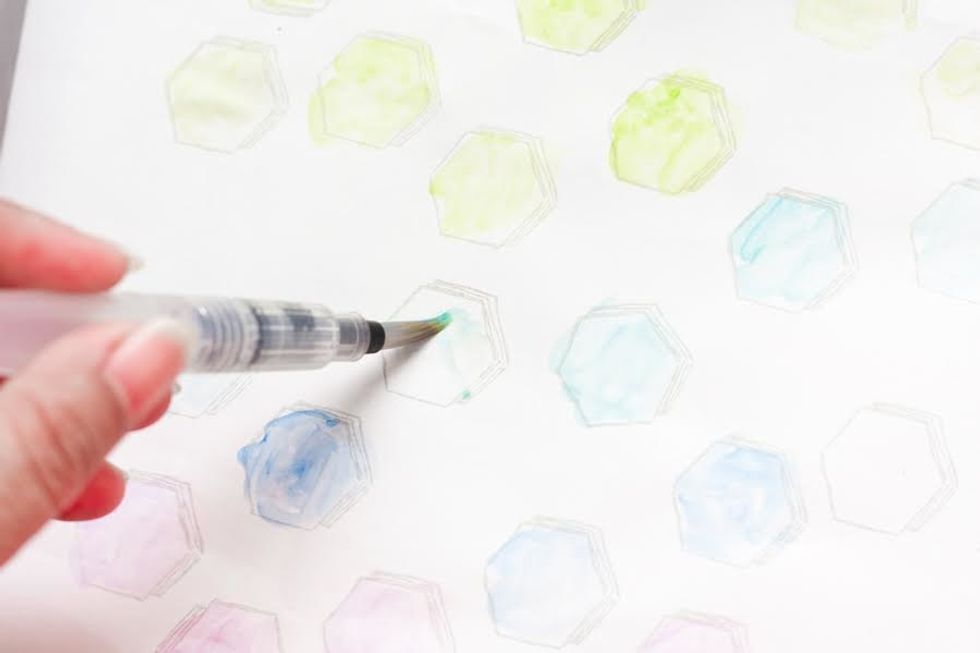 Gently color the stamp image with the oil pastel color. Use the colors that work with your party palette for sweet, custom results.