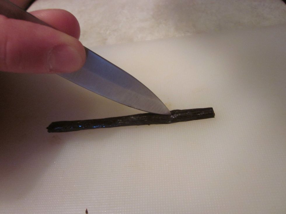 Gently cut them open length wise. Don't cut all the way through, just enough to split the pod open. Use a sharp knife. You could try a butter knife but that will fail and your family will laugh at you