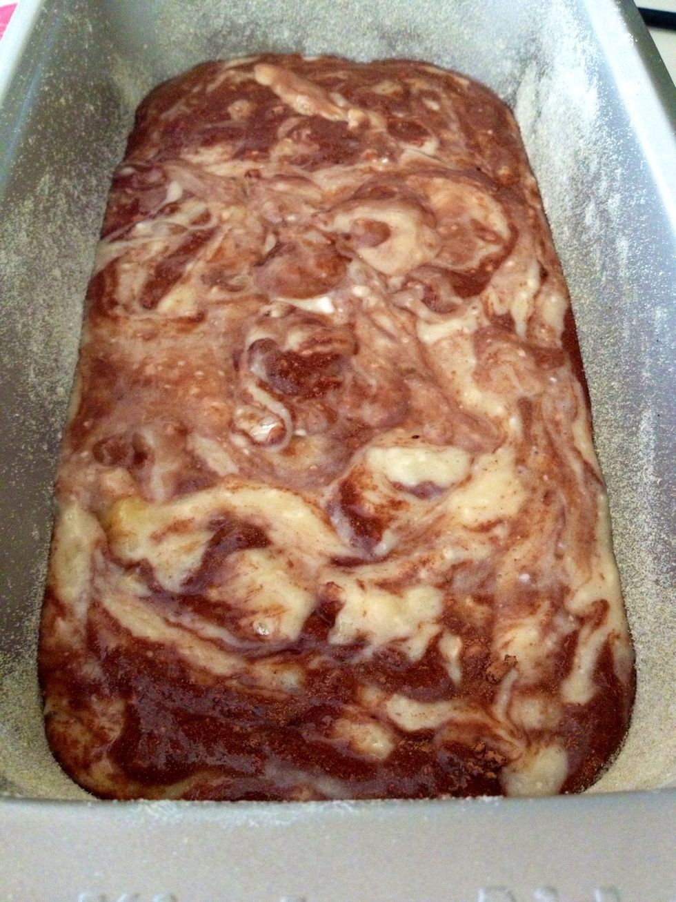 Gently fold; dont mix as this will completely blend in the two batters and you wont get a marble effect