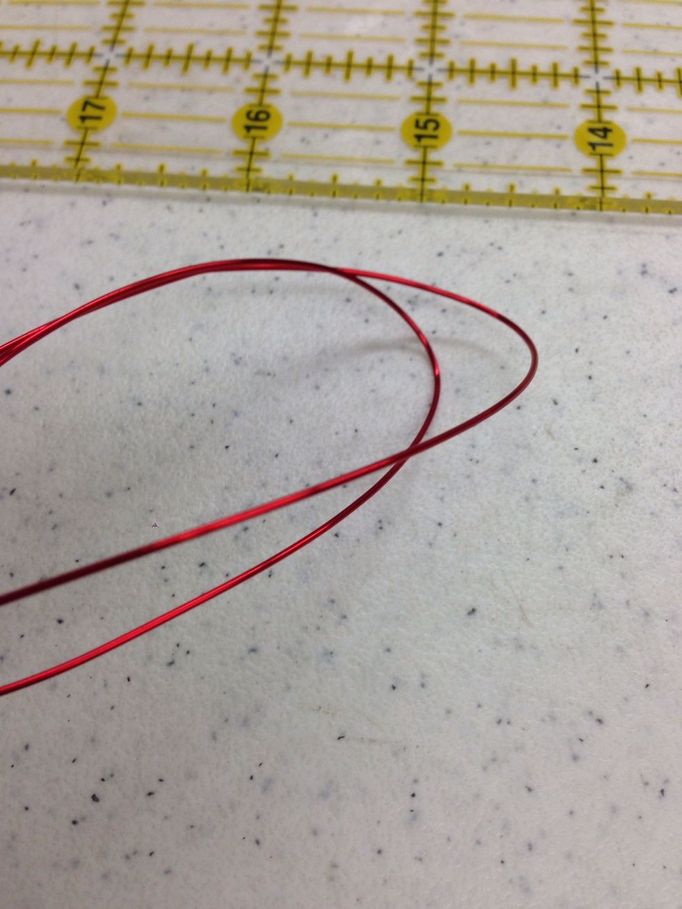 Gently fold each piece of wire in half.