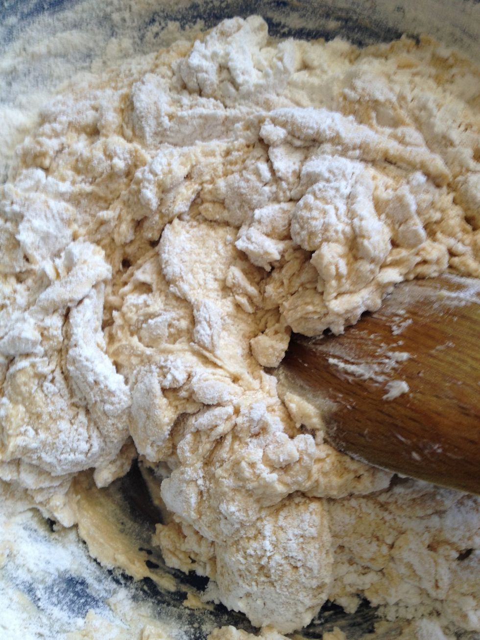 Gently fold flour into wet mixture, only 3 or 4 folds, and sift another third of flour into mixture.