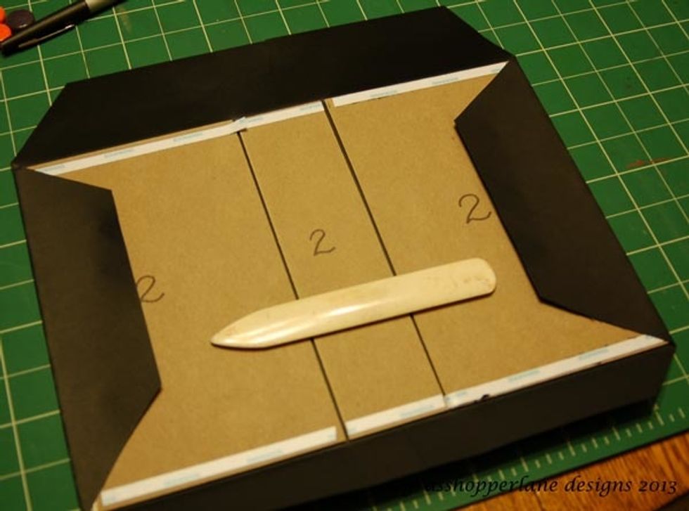 Gently fold over the edges, crease with bone folder and adhere.