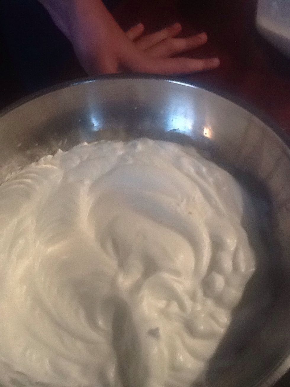 Gently fold the egg whites into the nut mixture in two batches.