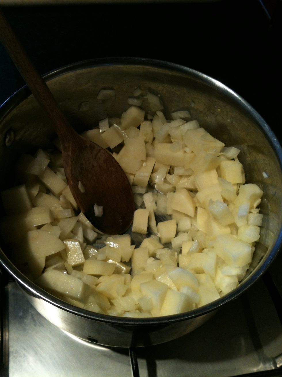 Gently fry the potato, onion and garlic in a little olive oil until the onions soften. 5-6 mins