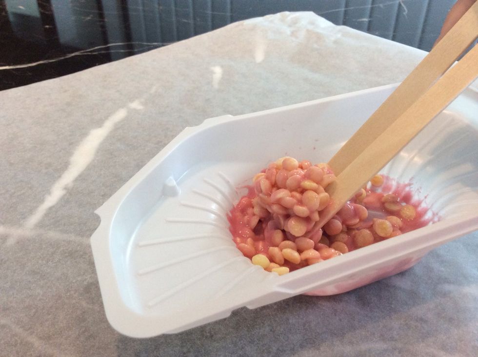 GENTLY mix it in or else you'll crush the puffs, this step might be a bit tougher to finish so just be patient and make sure each and every one of them are coated with the Strawberry stuff.