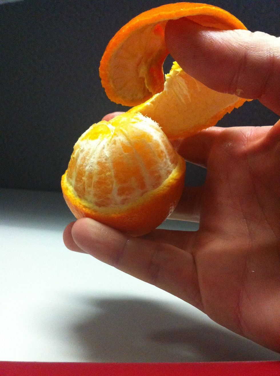 Gently peel the rind from the flesh of the orange. It may not all come off in one piece. This will depend on the ripeness of the fruit