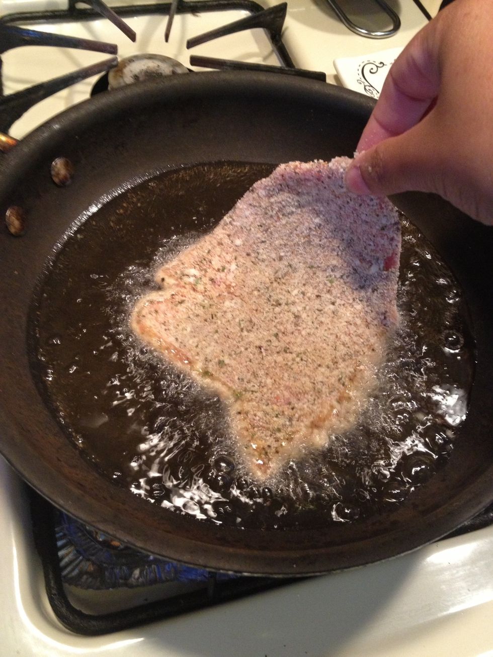 Gently place 1-2 veal in the oil.