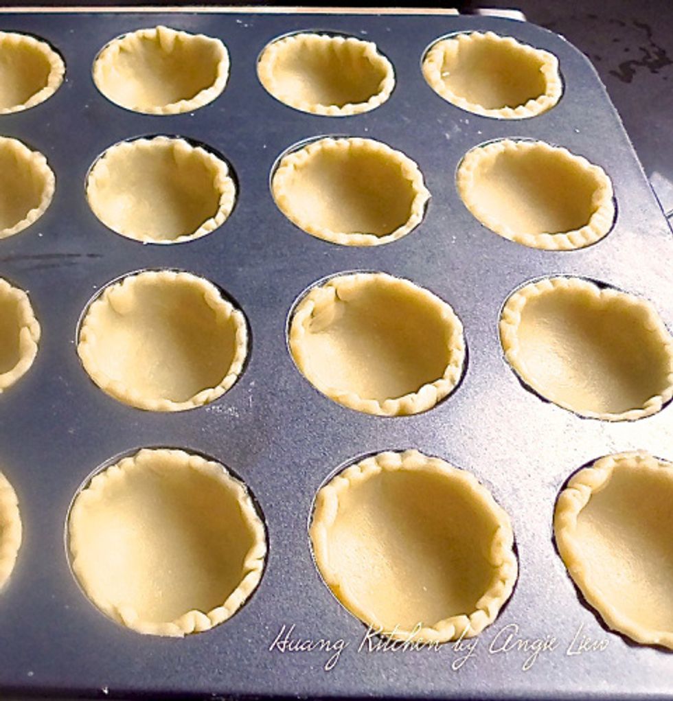 Gently place the rounds into the muffin cups.