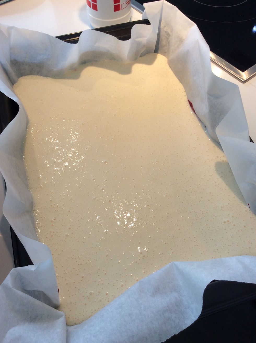 Gently pour the cream cheese mixture on the red velvet