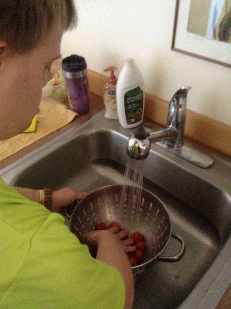 Gently pour tomatoes into colander and wash in sink