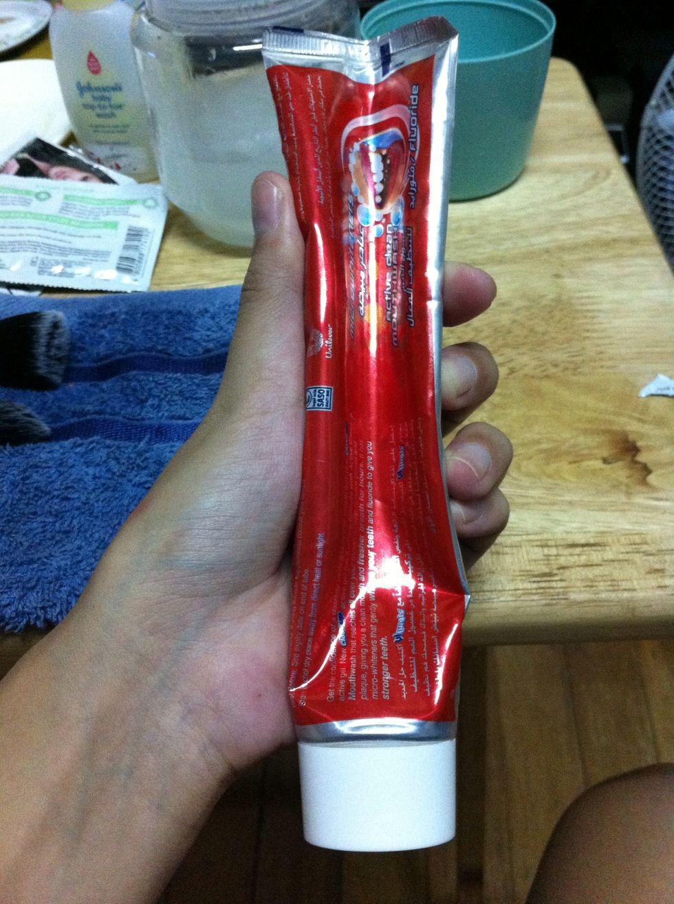 Gently press the tube like so, to make a "hump" when placed under the towel.