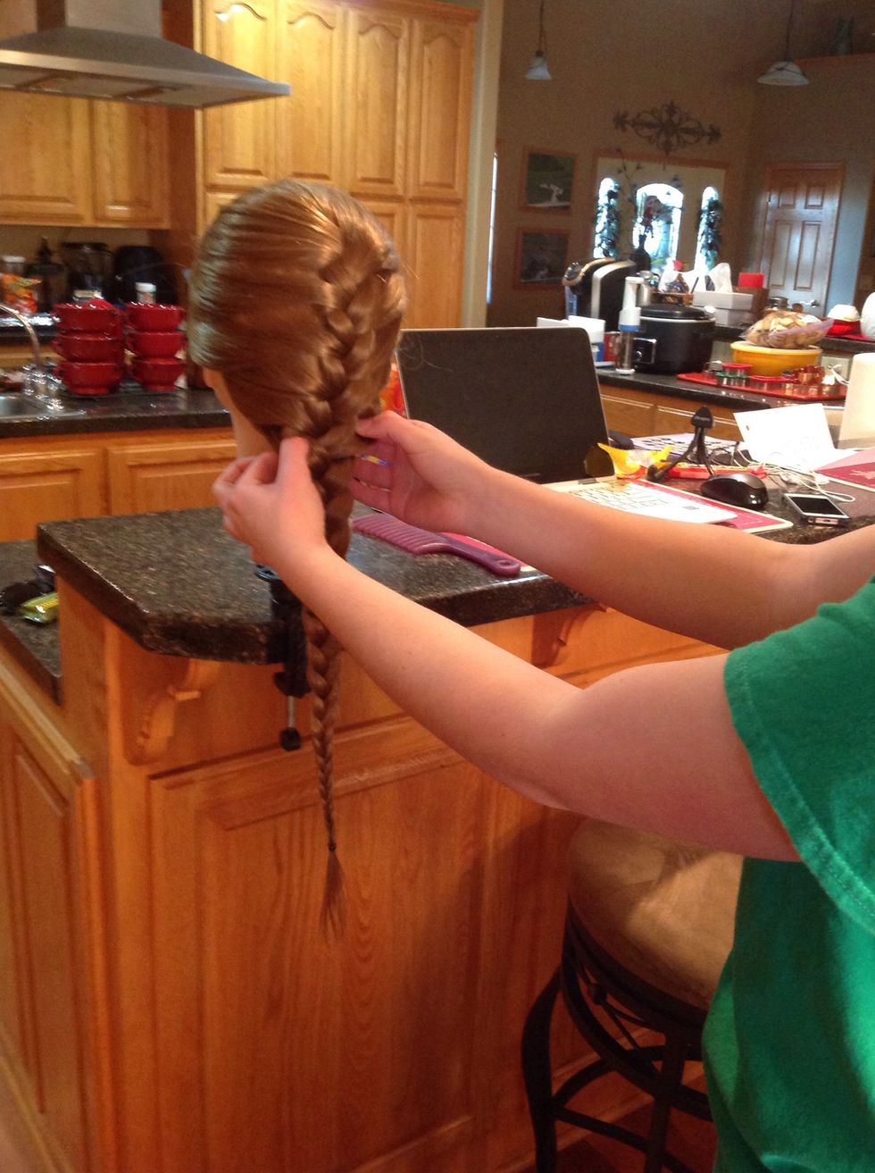 Gently pull on every piece of the braid to create a bigger, more even braid.