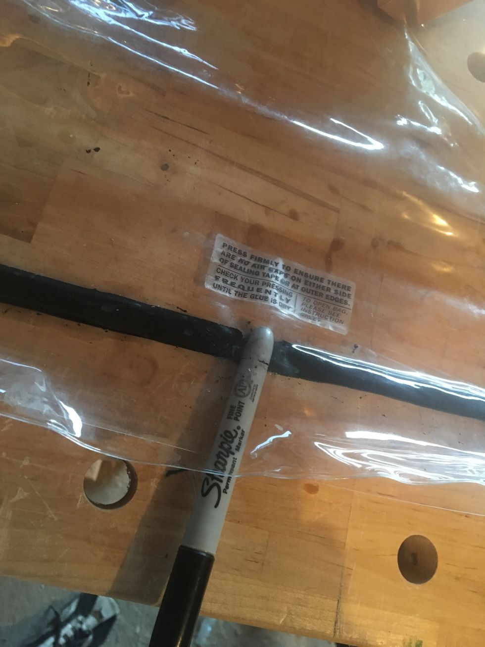 Gently push a blunt object through the sealing tape. (try to keep sealing tape on one side)