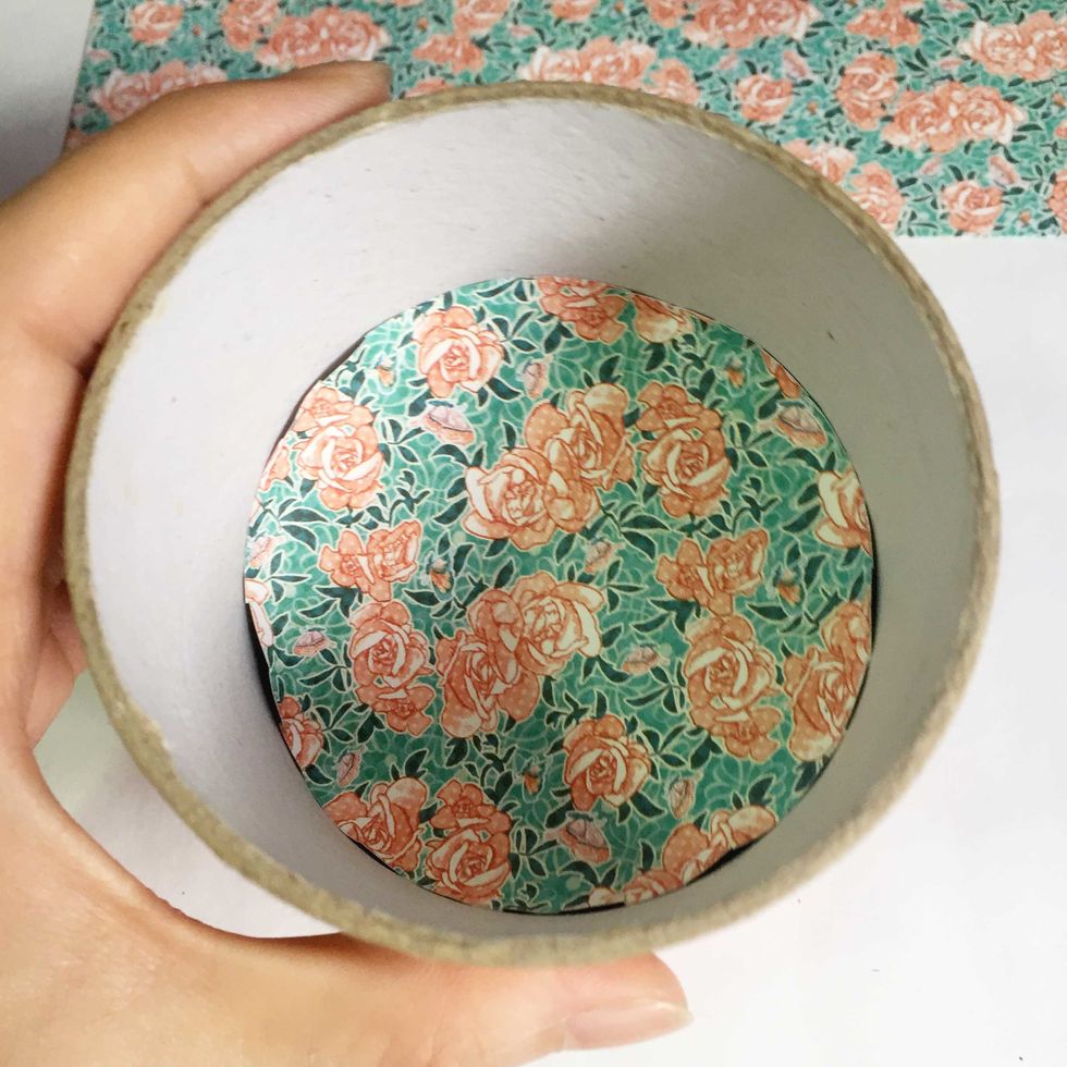 Gently push the pattern paper into the centre of the roll.