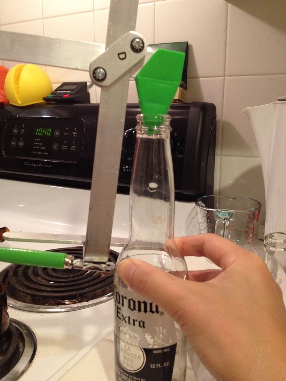 Gently put the cutter on the bottle
