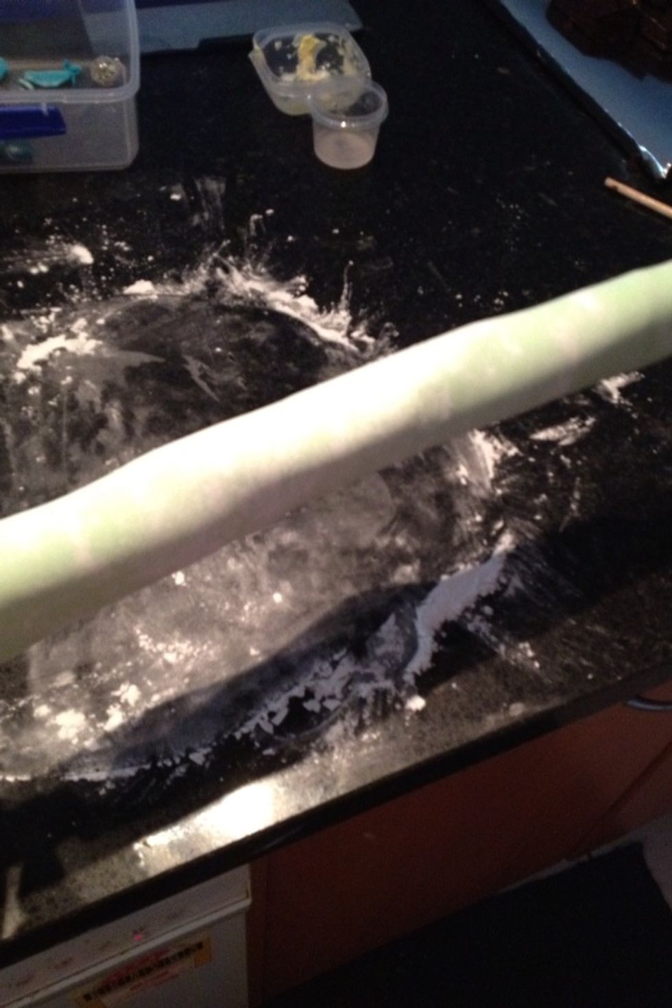 Gently roll it on to a stick so you can move it and cover the body