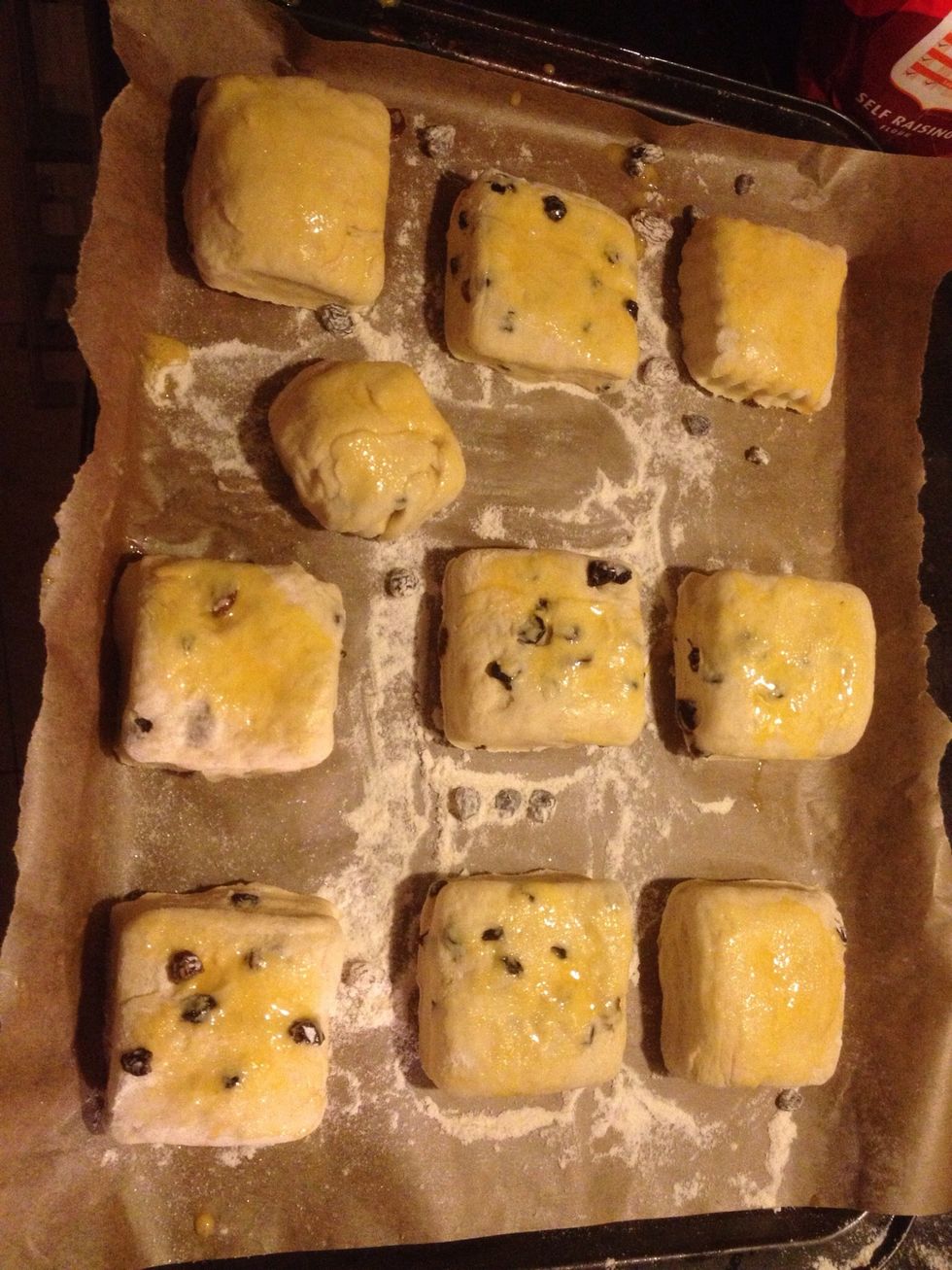 Gently roll out your dough to about 1.5 inches, Use a pastry cutter or round glass dipped in flour to cut out your scones. place on a baking tray & leave for about 15 minutes.