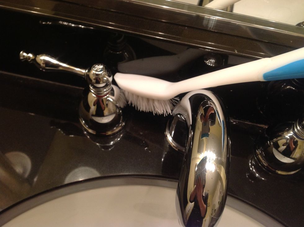 Gently scrub with old toothbrush or cloth until residue is released.