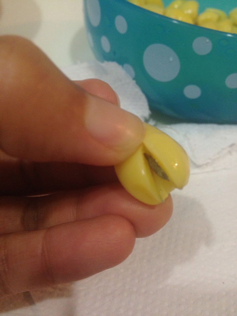 Gently squeeze open and you will see the centre core.