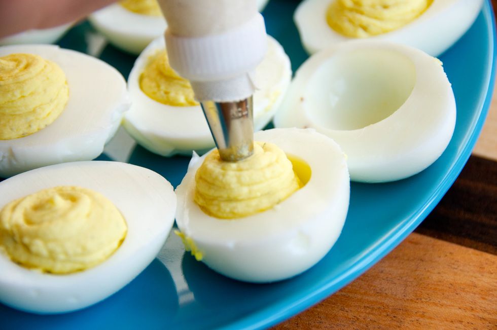 Gently squeeze the bag until you fill the egg with as much of the yolk mixture you like!