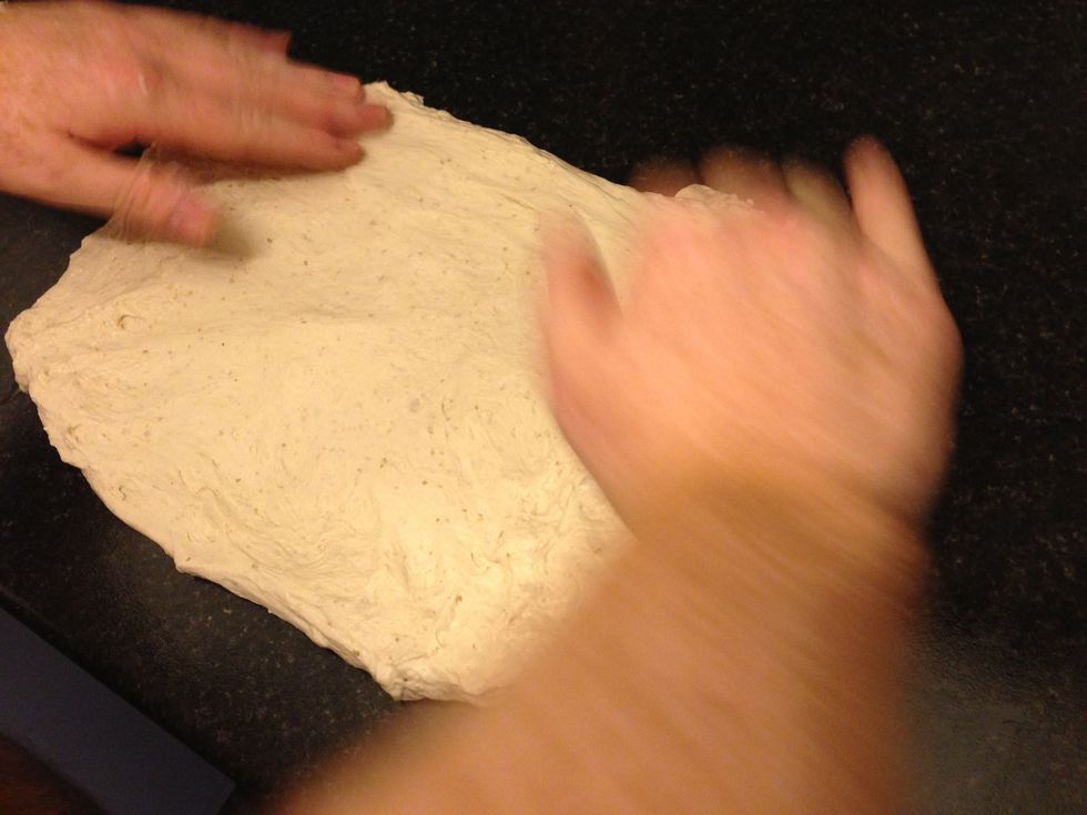 Gently stretch the dough into a rectangle.