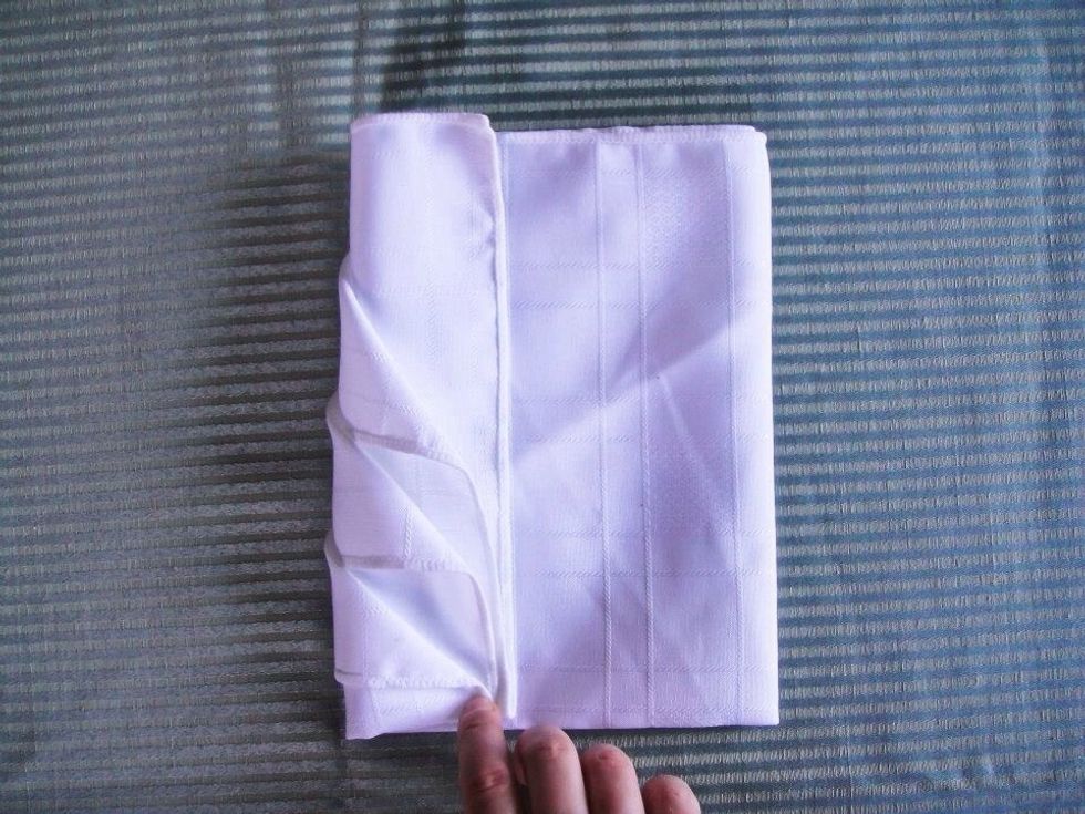 Gently turn it over and fold the left side to the middle