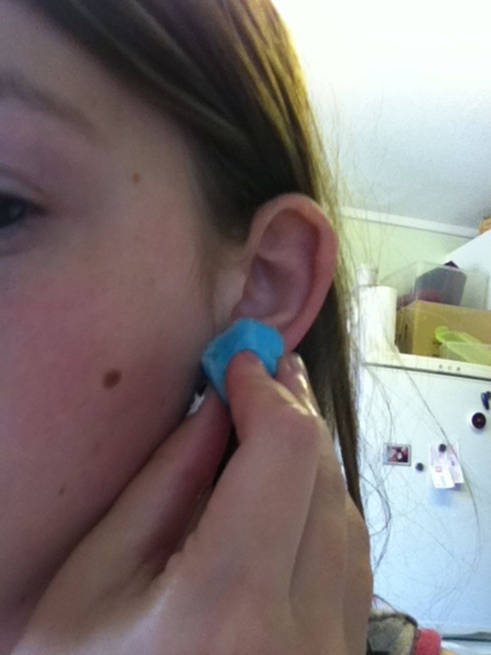 Gently wash against the infected area and slowly twist the ear back and forth