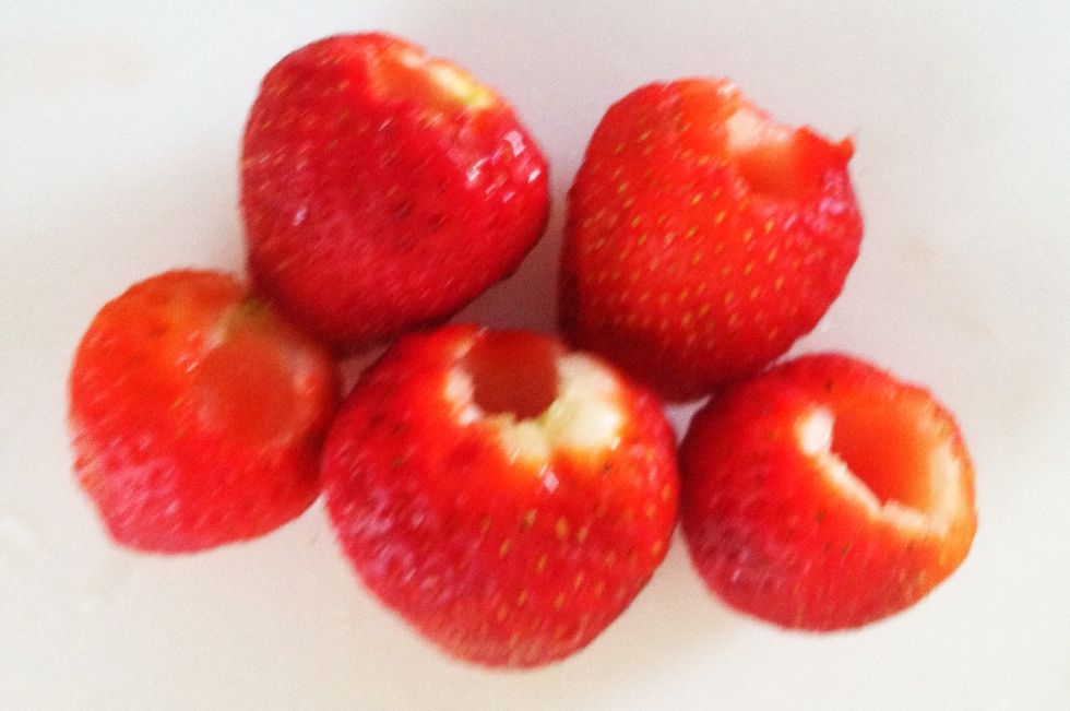 Gently wash and pat strawberries dry, then core them. (See my guide on how to core strawberries in one step)