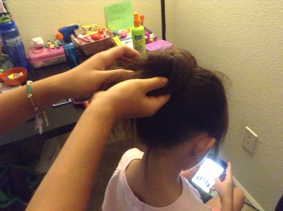Gently wrap the hair around the hair tie