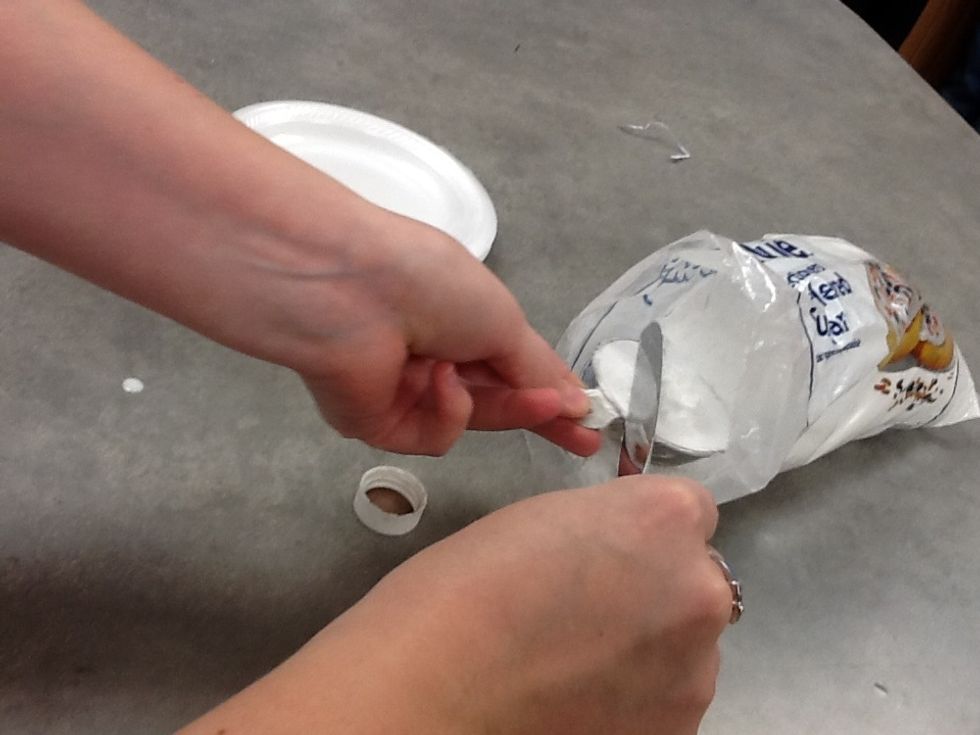 Get 1/4 cup of powdered sugar. Use back of knife to level off extra.
