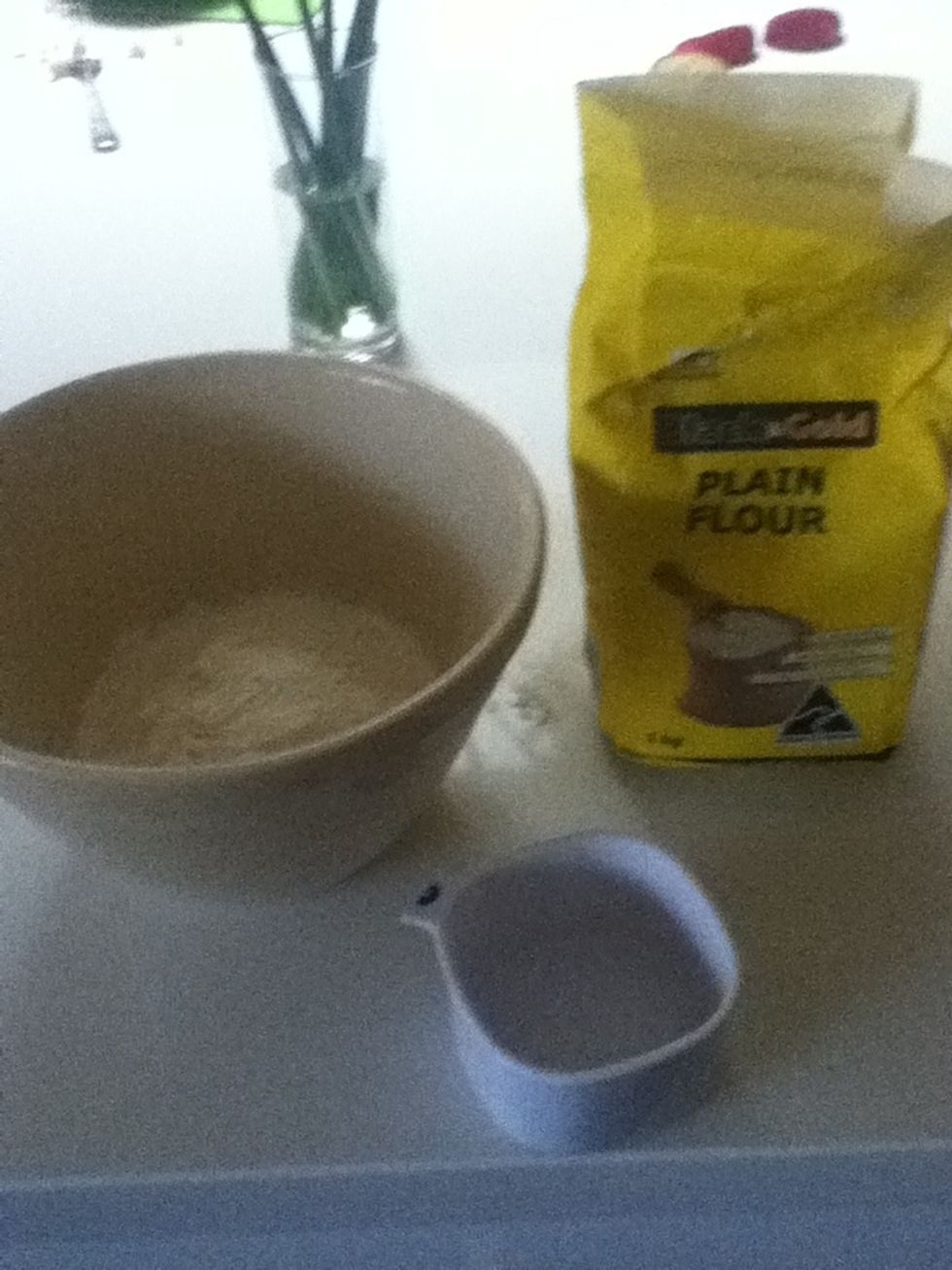 Get 1 cup of flour and put it in a bowl