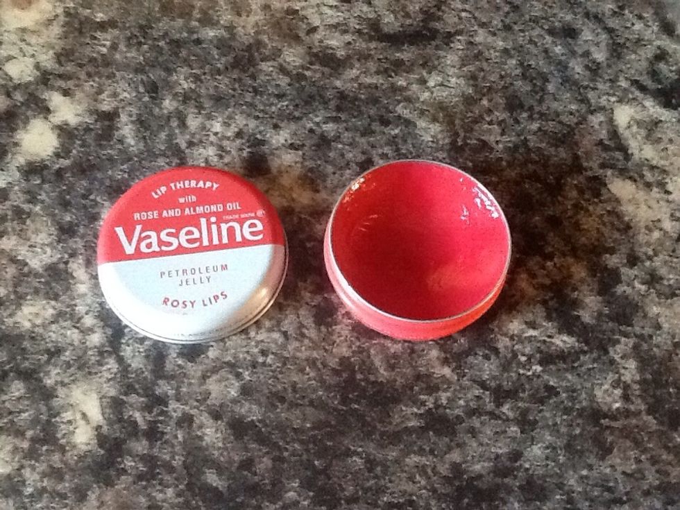Get 1 tablespoon of petroleum jelly or Vaseline, I am using up some old rose Vaseline I have.
