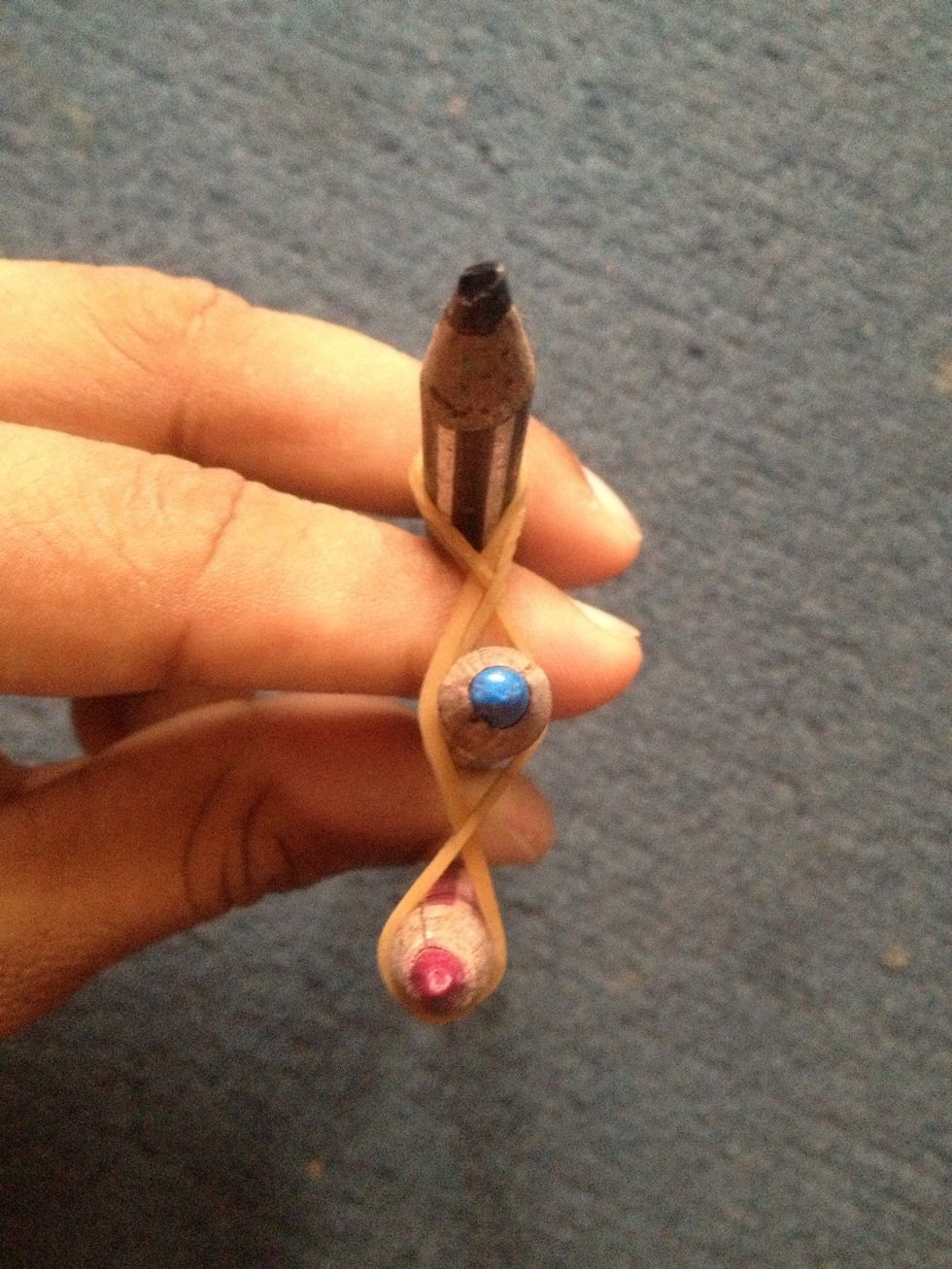 Get 3 small pencils and tie like this..