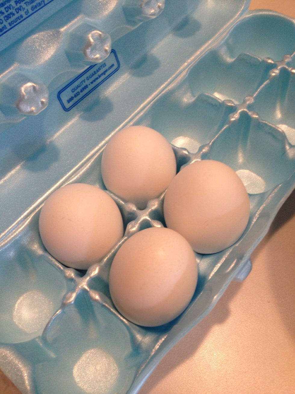 Get 4 eggs. Crack them and add to a separate bowl. Whisk well.
