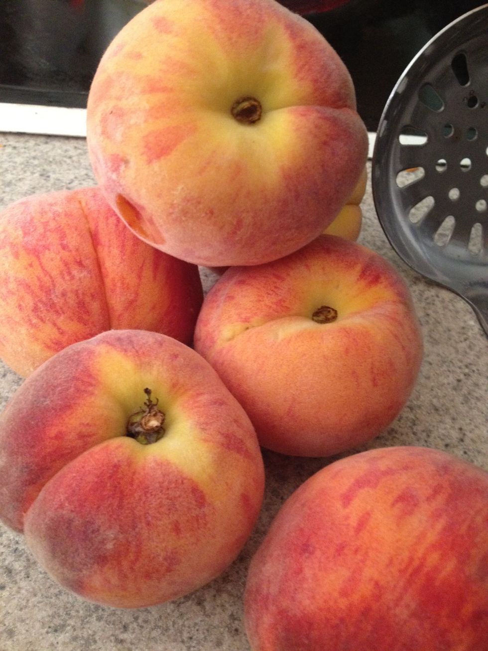 Get 7 big fresh ripe peaches. The first thing you'll need to do is peel them.