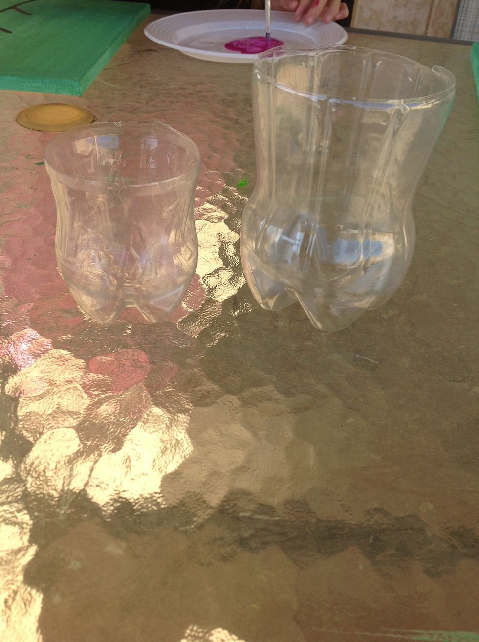 Get a 1.25 litre bottle and a 600 ml bottle and empty them and cut top off. These will print the flowers.