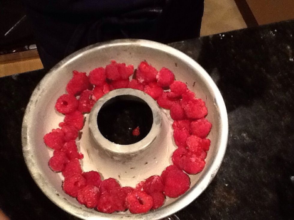 Get a baking tin and place raspberries on the bottom