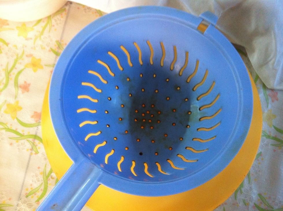 Get a big strainer and place it over a bowl.