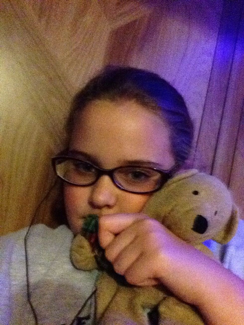 Get a blanket or a stuffed animal to sleep with. If your friend makes fun of you, she is not a real friend. We all need a little something to help us fall asleep! If it makes you comfortable go ahead!