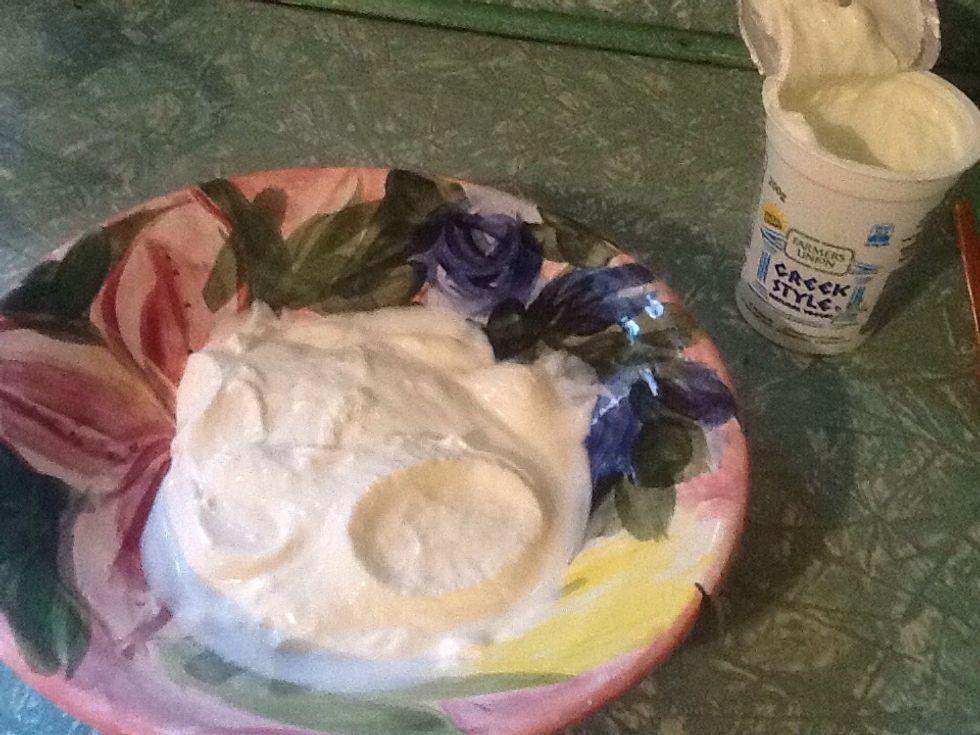 Get a bowl and put 100g of Greek yoghurt in.