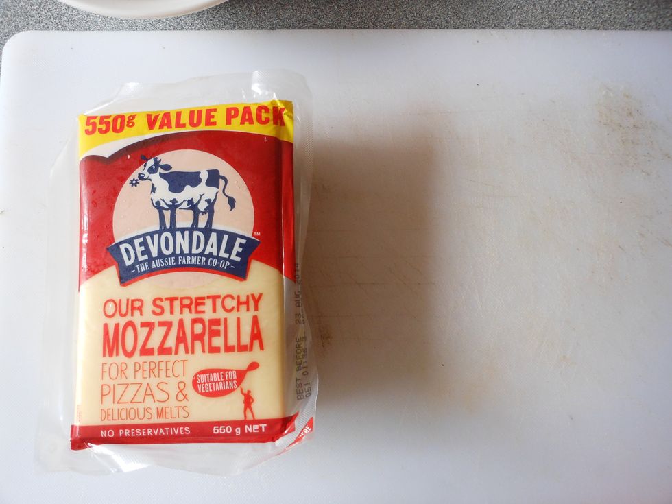 Get a chopping board & knife, and the mozzarella cheese.