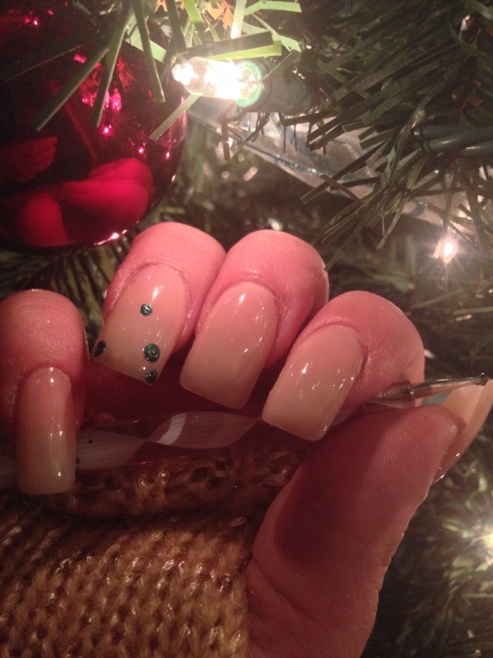 Get a dark green polish and place some green dots.