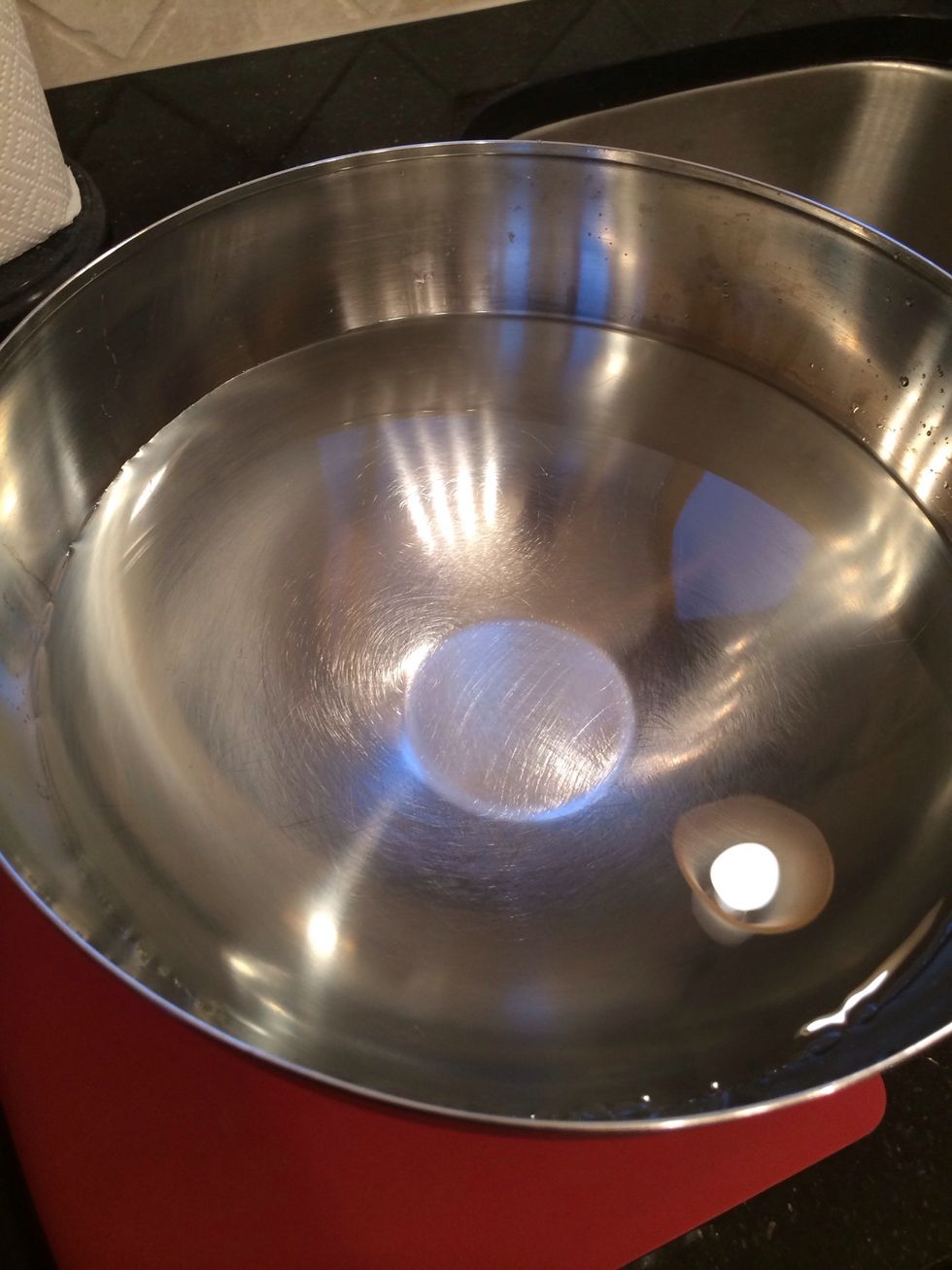 Get a deep bowl and fill it with water, so you can submerge a pomegranate in it