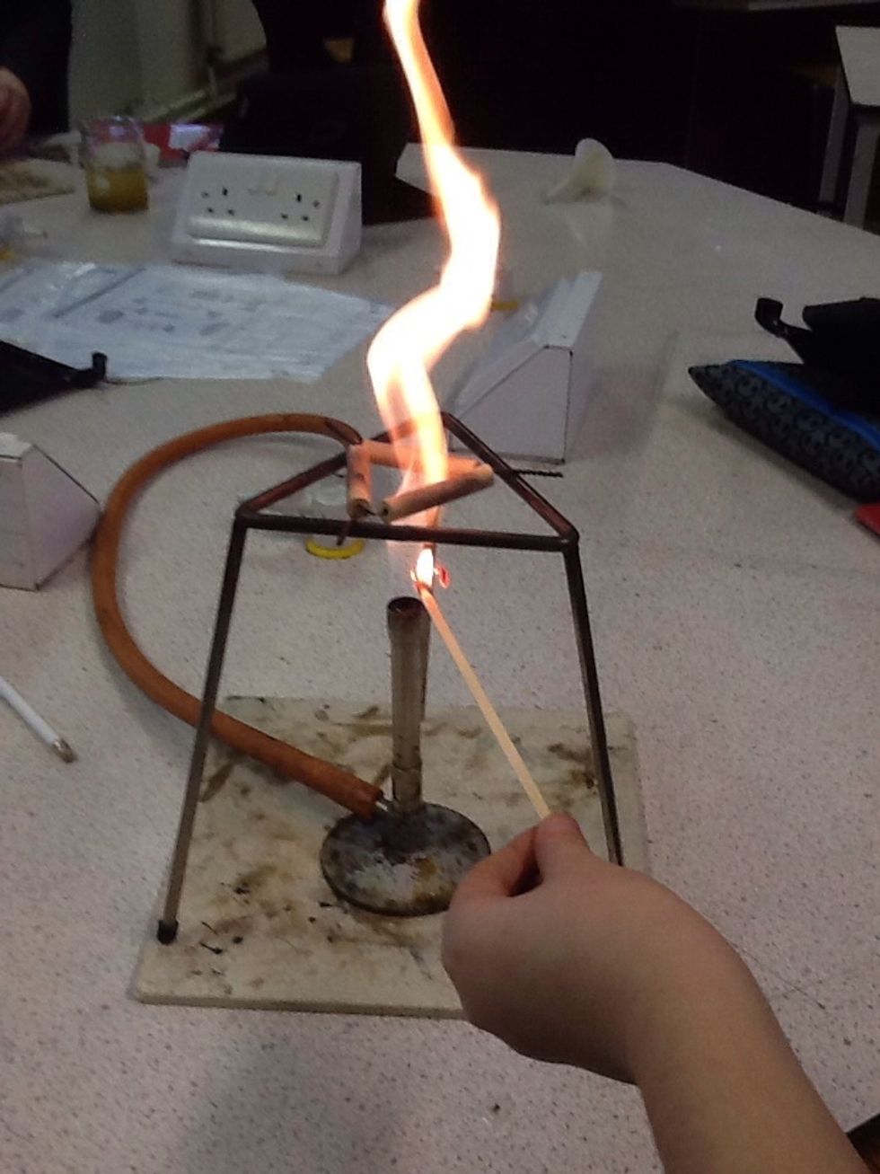 Get a fire stick and light a fire... Carefully and slowly place the stick over the gas burner... And turn the gas on...