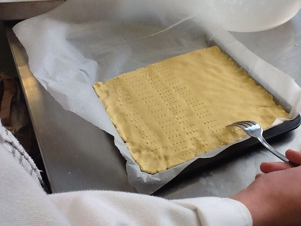 Get a fork and prick lightly into the dough.