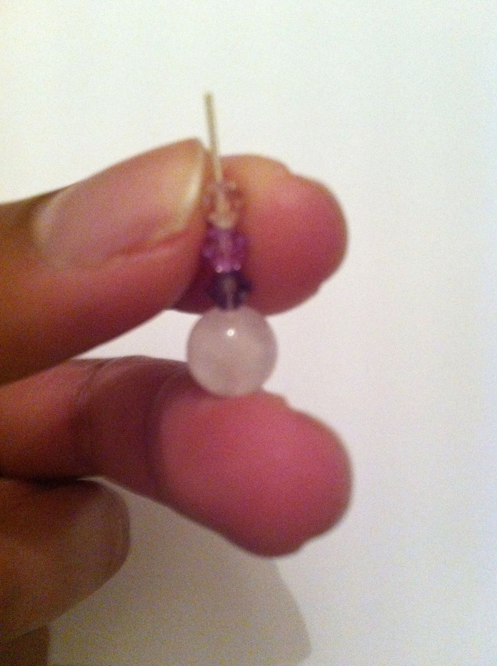 Get a good grip on your head pin with the beads and grab your pliers with the other hand