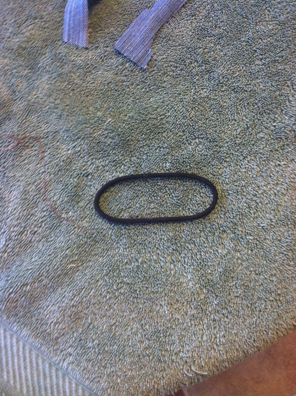 get a hair tie and stretch it out
